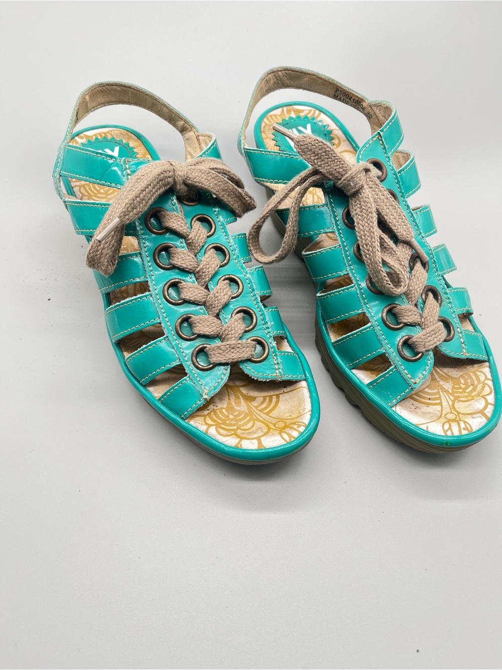 Fly London “Yito” teal patent leather caged wedge lace-up sandals. Size 40.